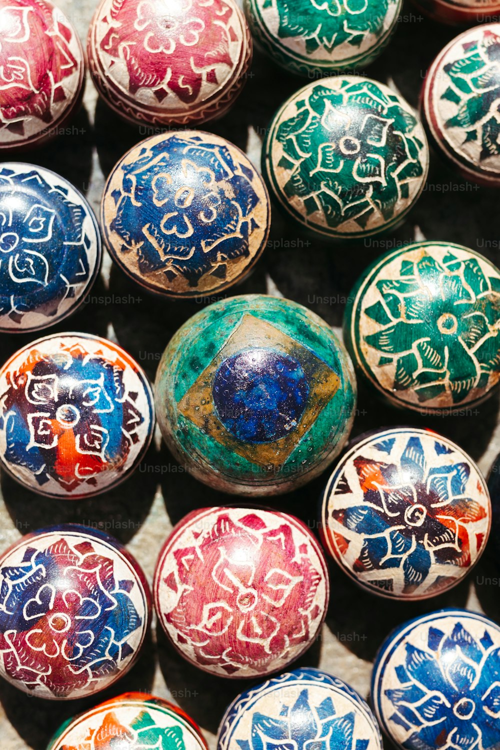a close up of many different colored balls