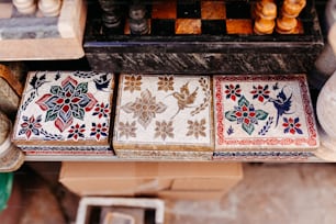 a close up of a set of four tiles