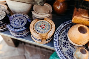 a table topped with blue and white plates and bowls