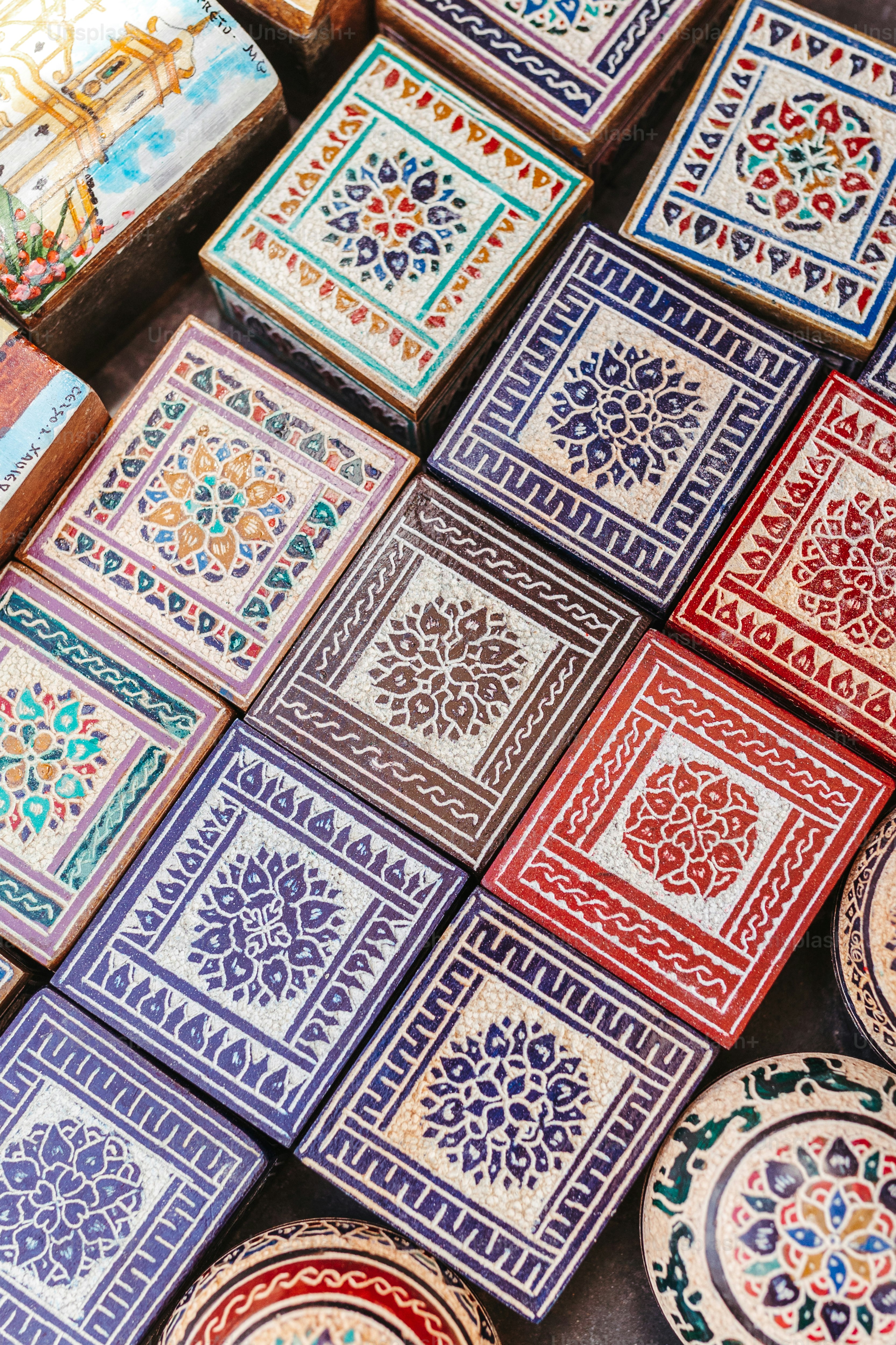a table topped with lots of colorful tiles