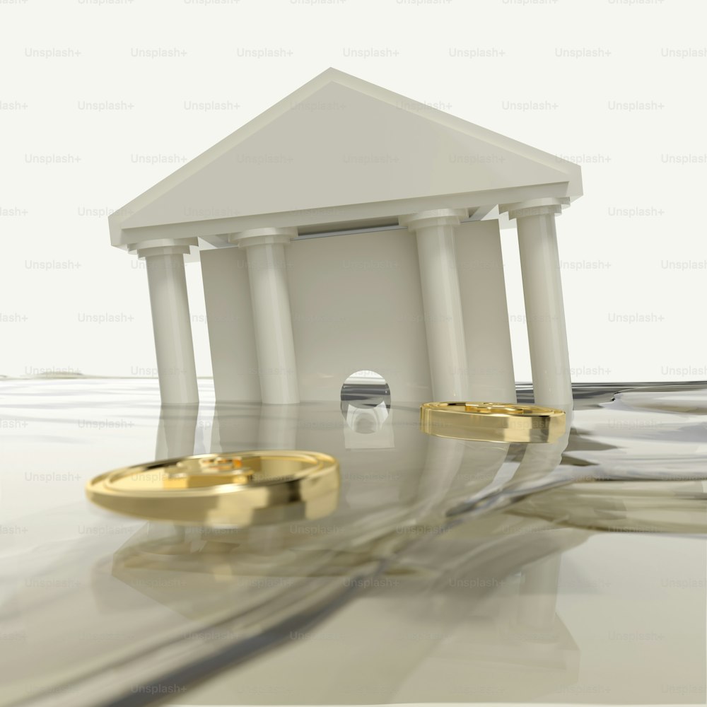 a white building with columns and a gold ring