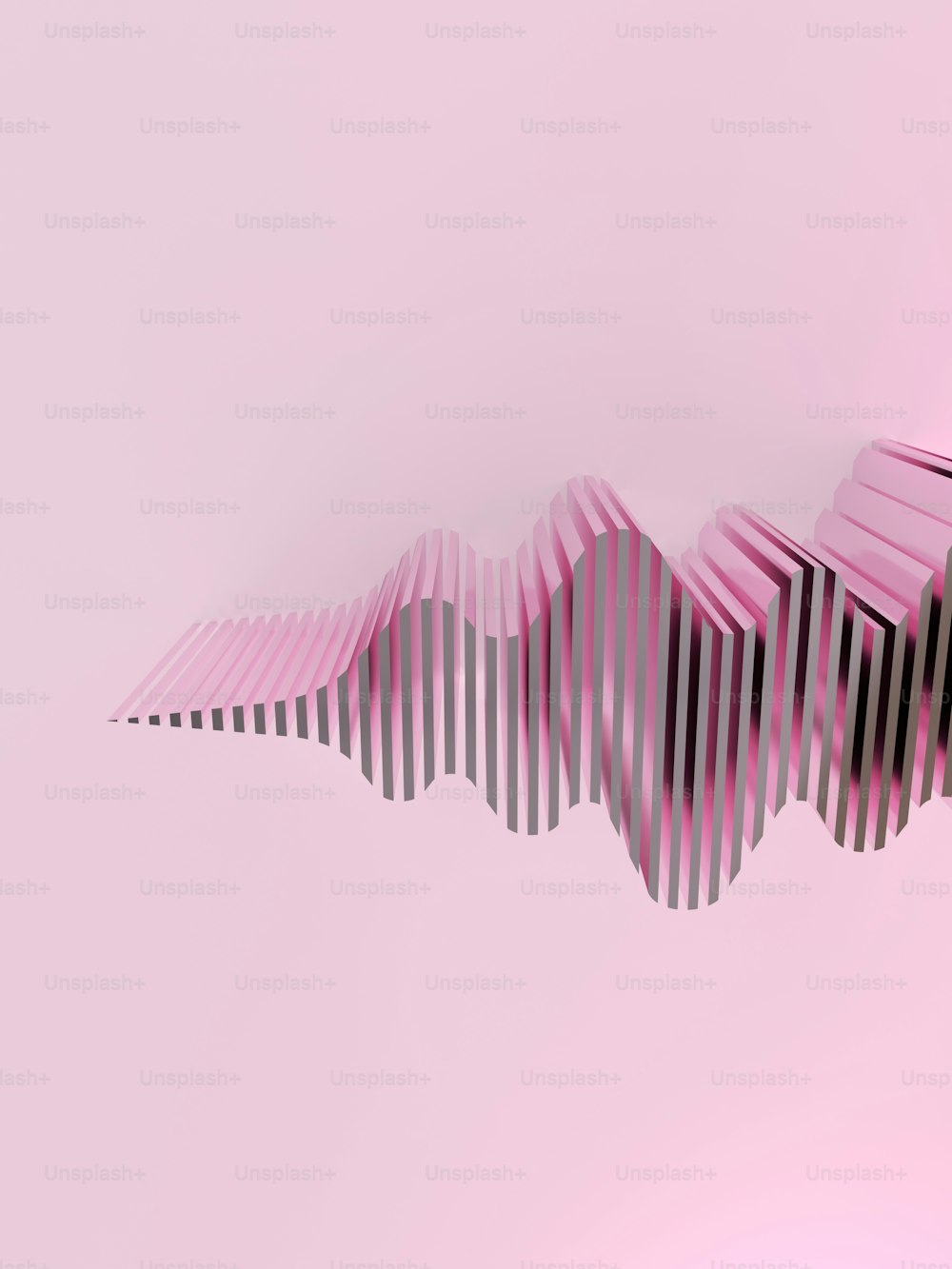 a pink and black striped object on a pink background