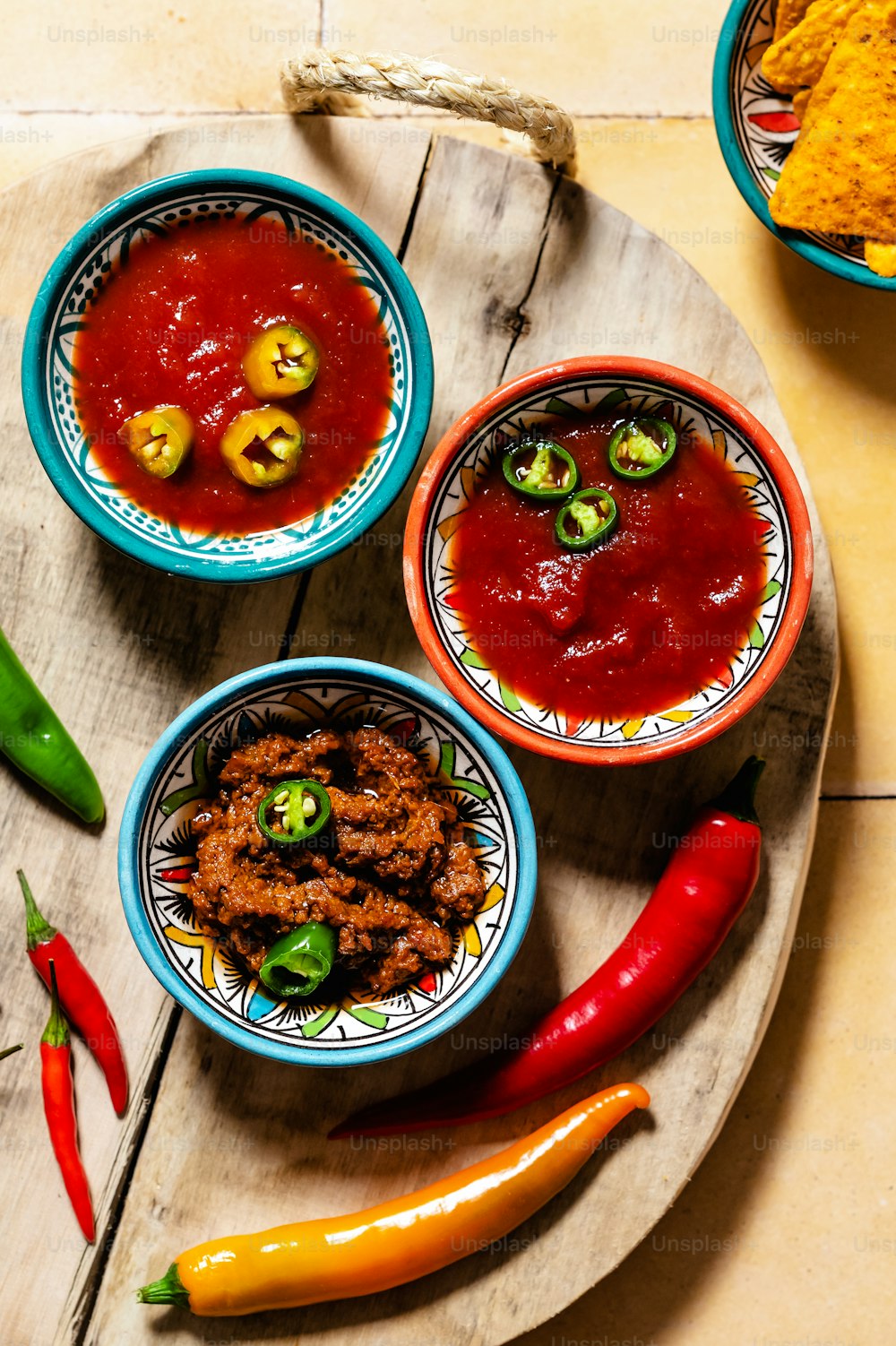 three bowls filled with different types of food