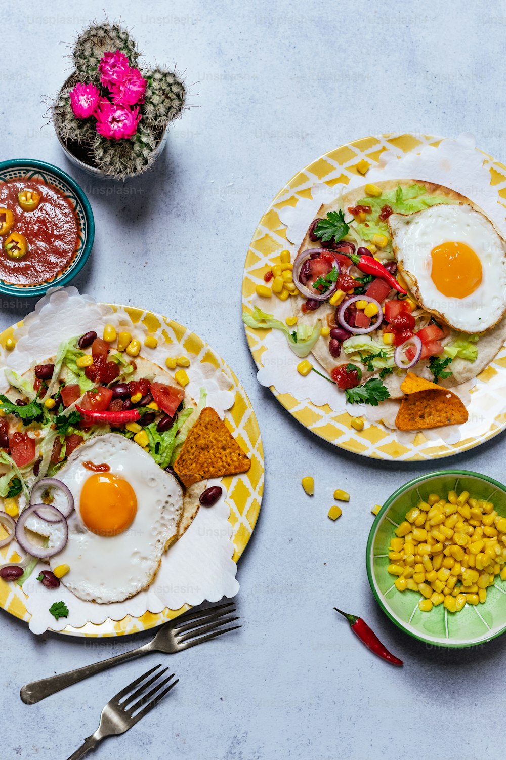 a table topped with two plates of food