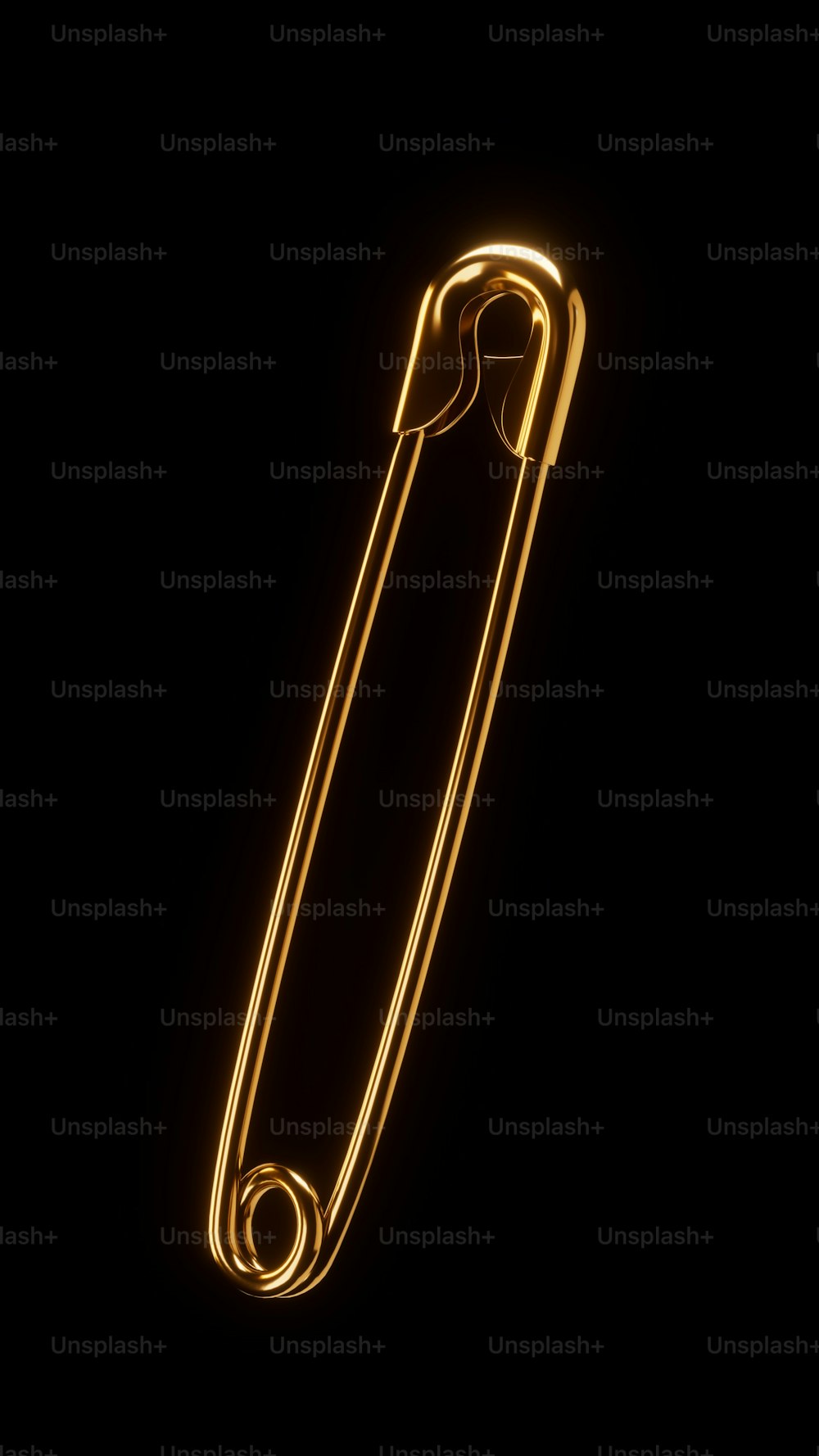 a gold colored paper clip on a black background