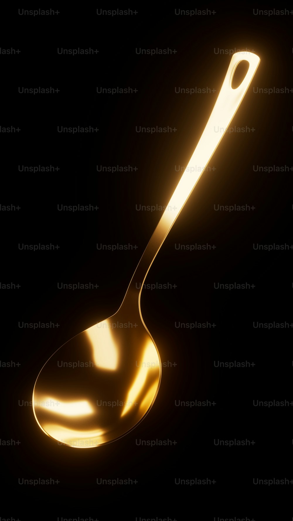 a golden spoon on a black background