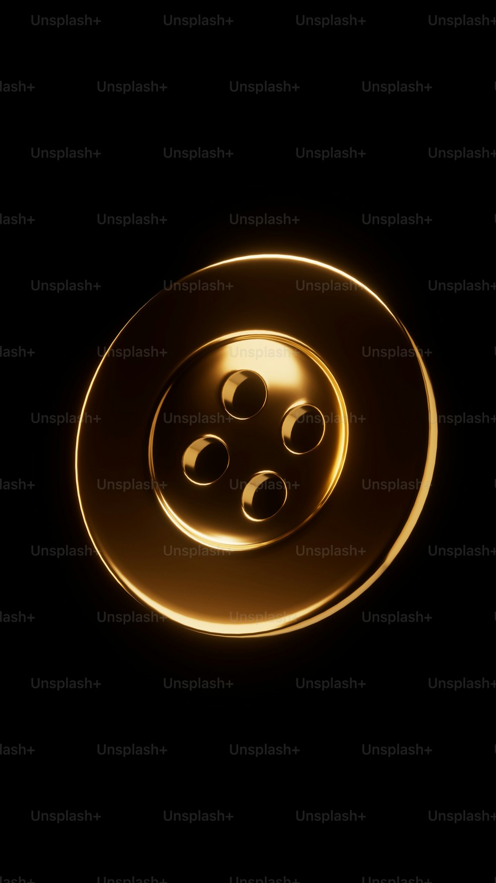 a gold button with four holes on a black background