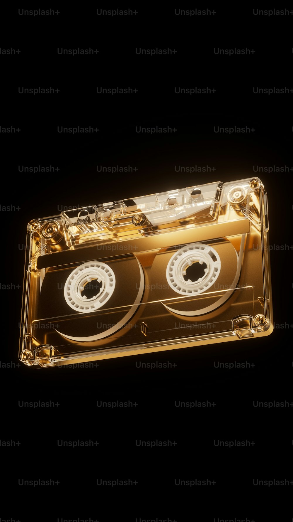 a golden cassette with two white discs on it