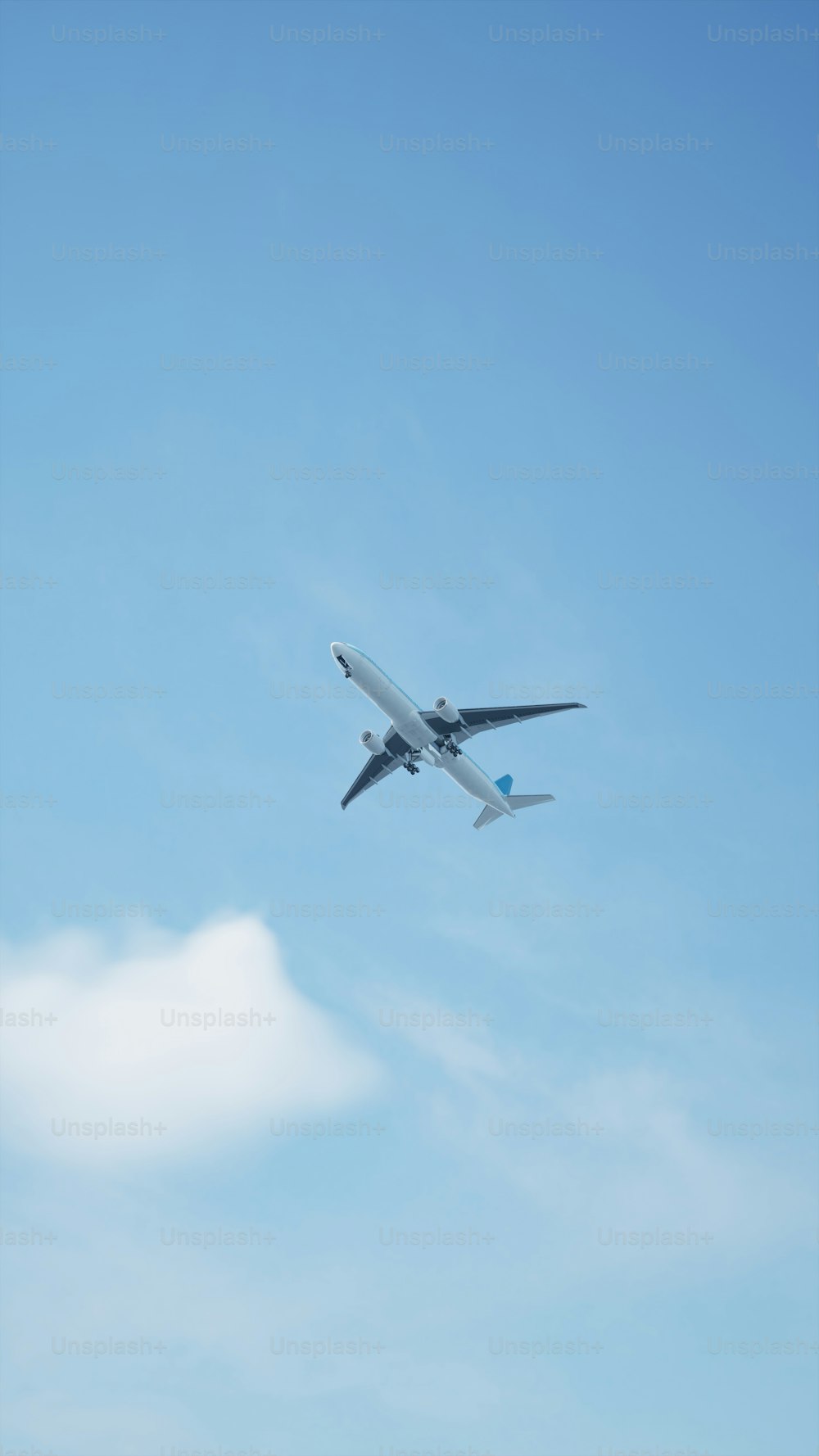 a large airplane flying through a blue sky