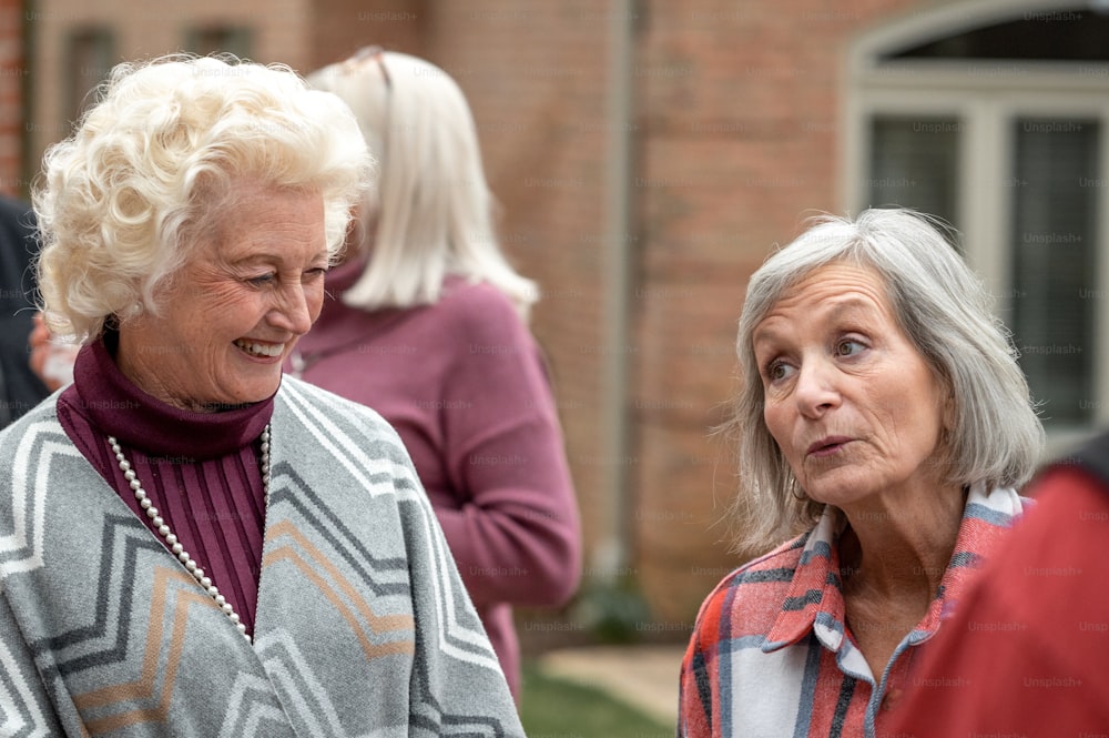 two older women standing next to each other