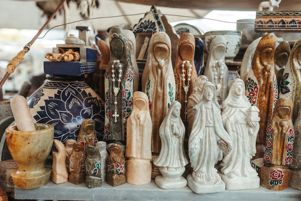 a group of ceramic figurines sitting on top of a table