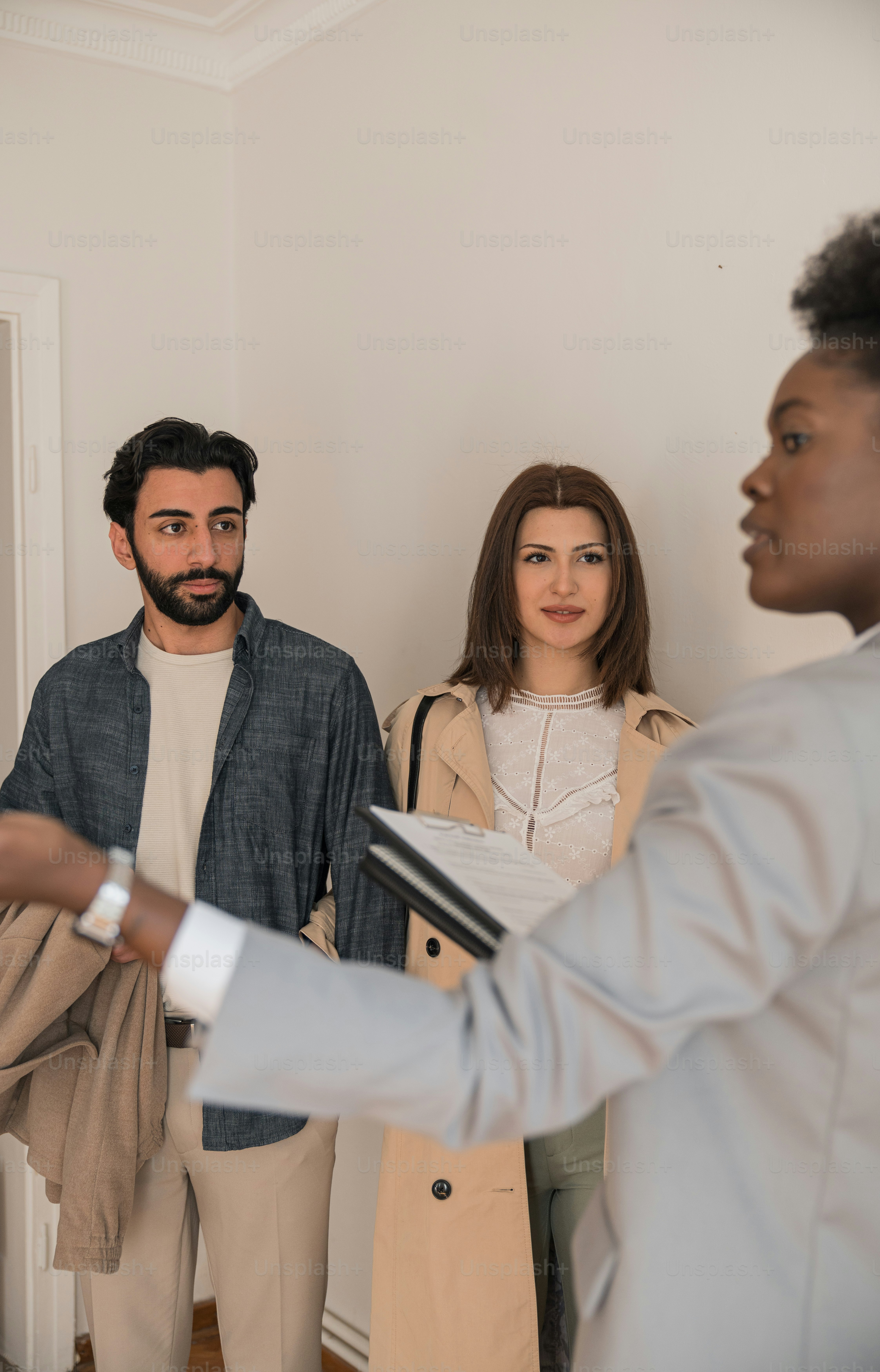 a group of people standing in a room
