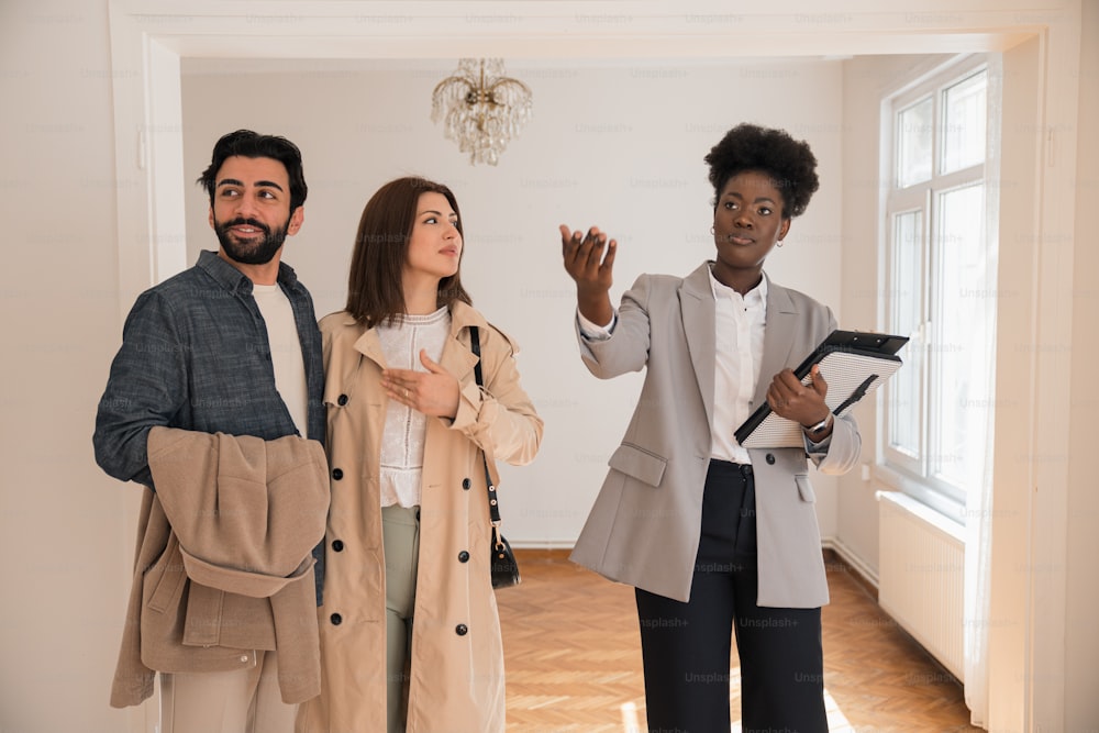 a group of people standing in a room