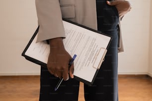 a woman holding a clipboard and a pen