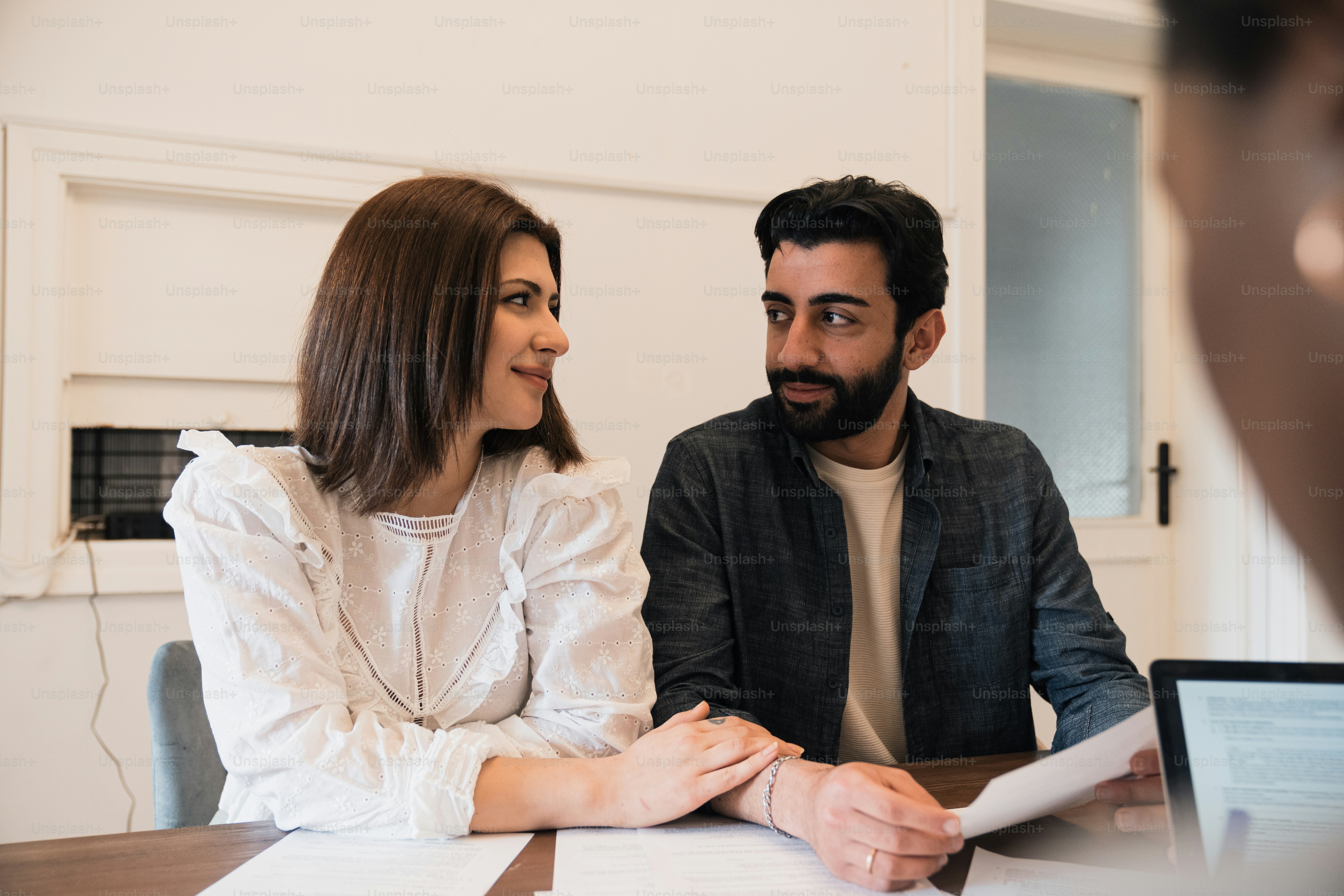 a man and a woman sitting at a table