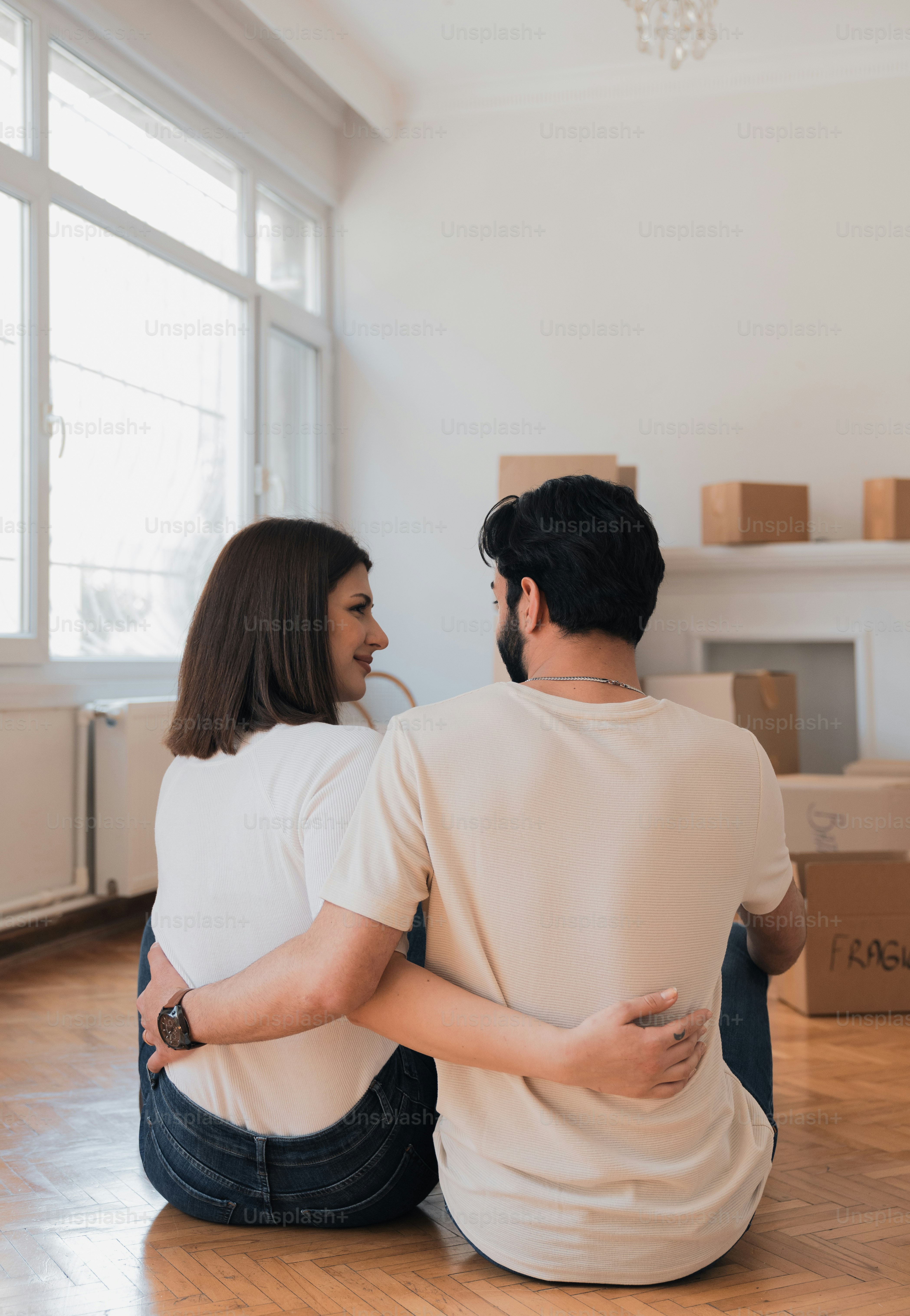 a man and a woman sitting on the floor