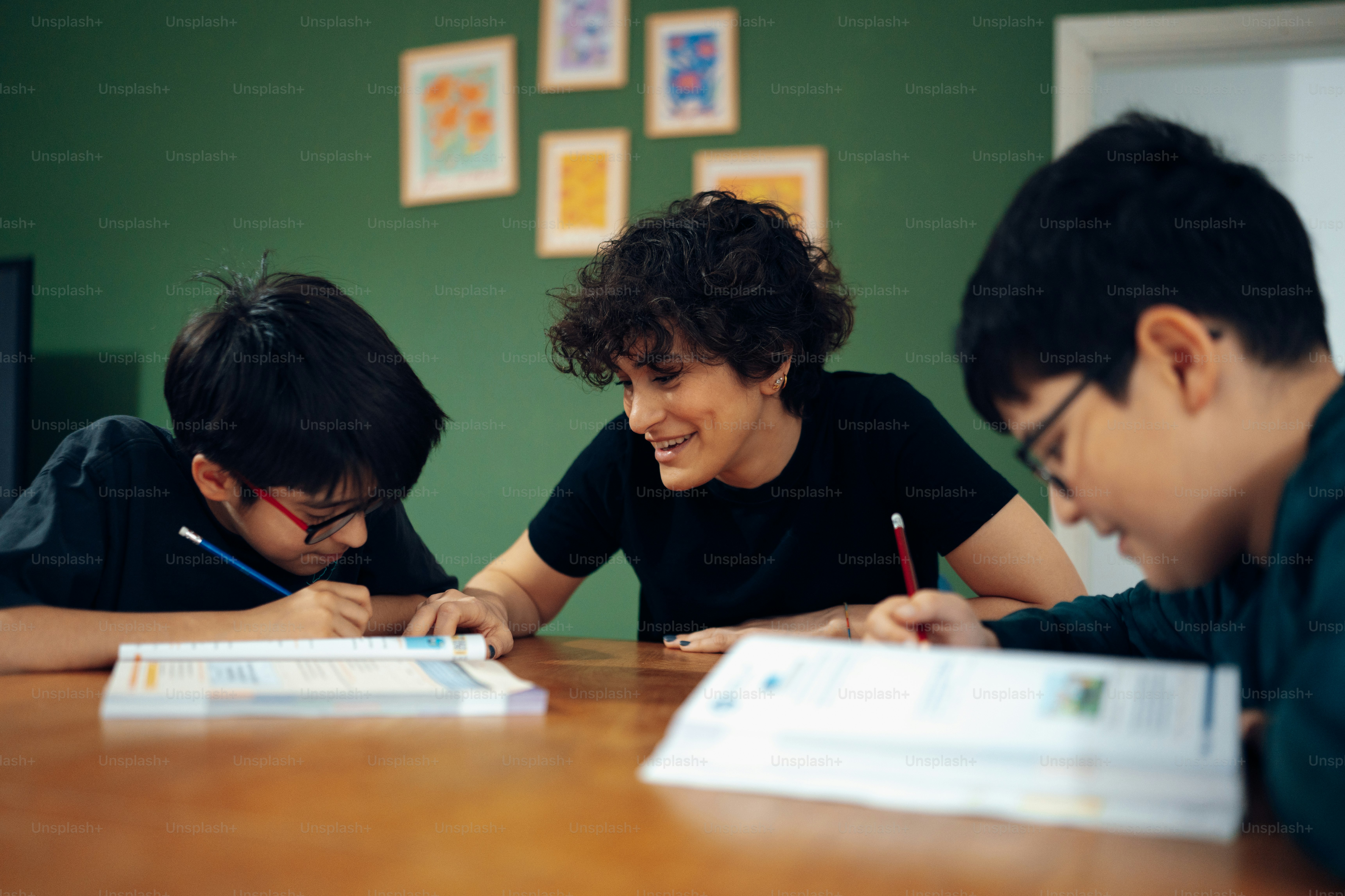 a group of people sitting around a wooden table
