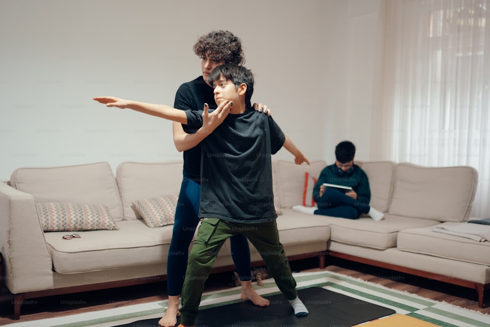 a man and a woman doing yoga in a living room