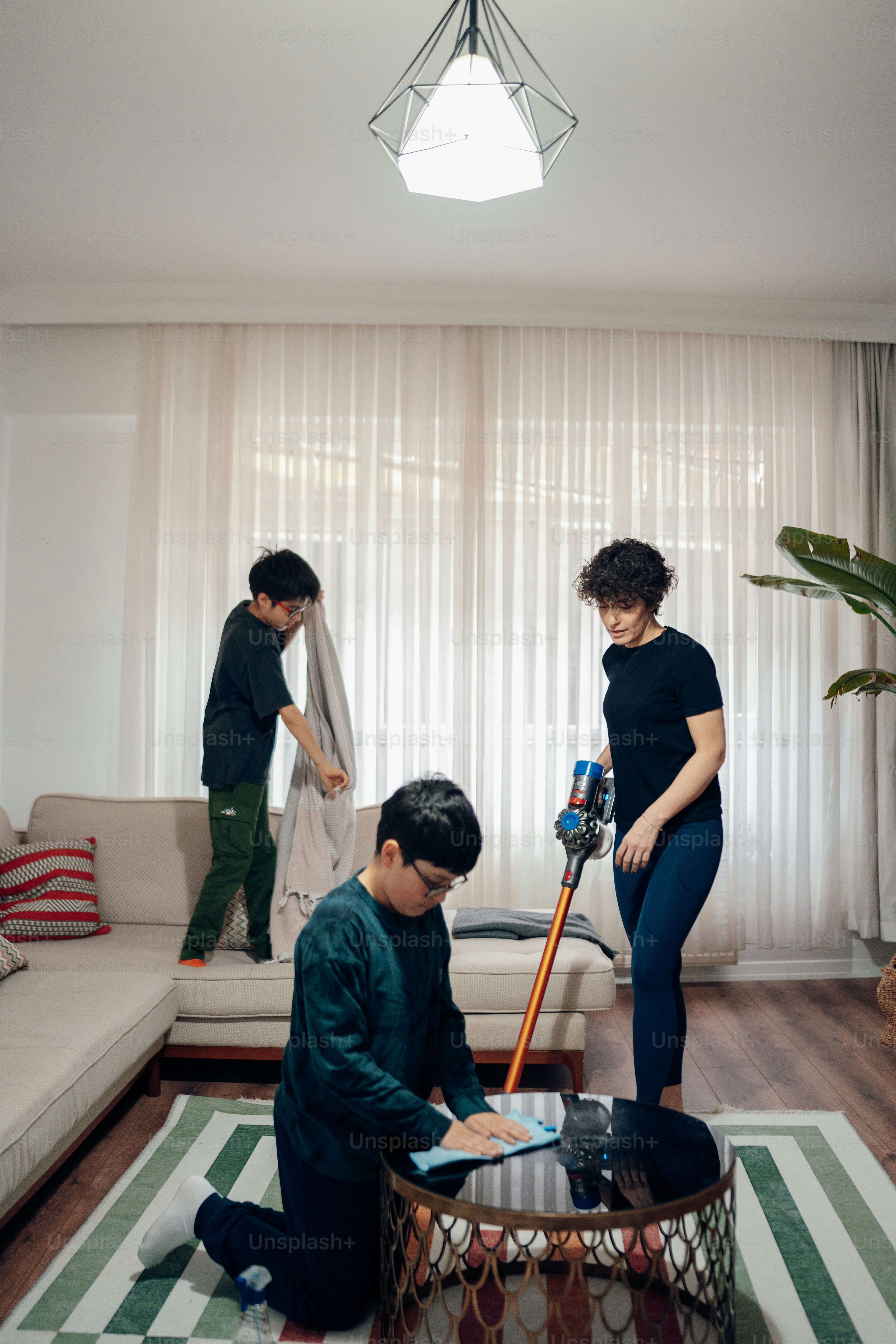 a couple of people that are standing in a living room