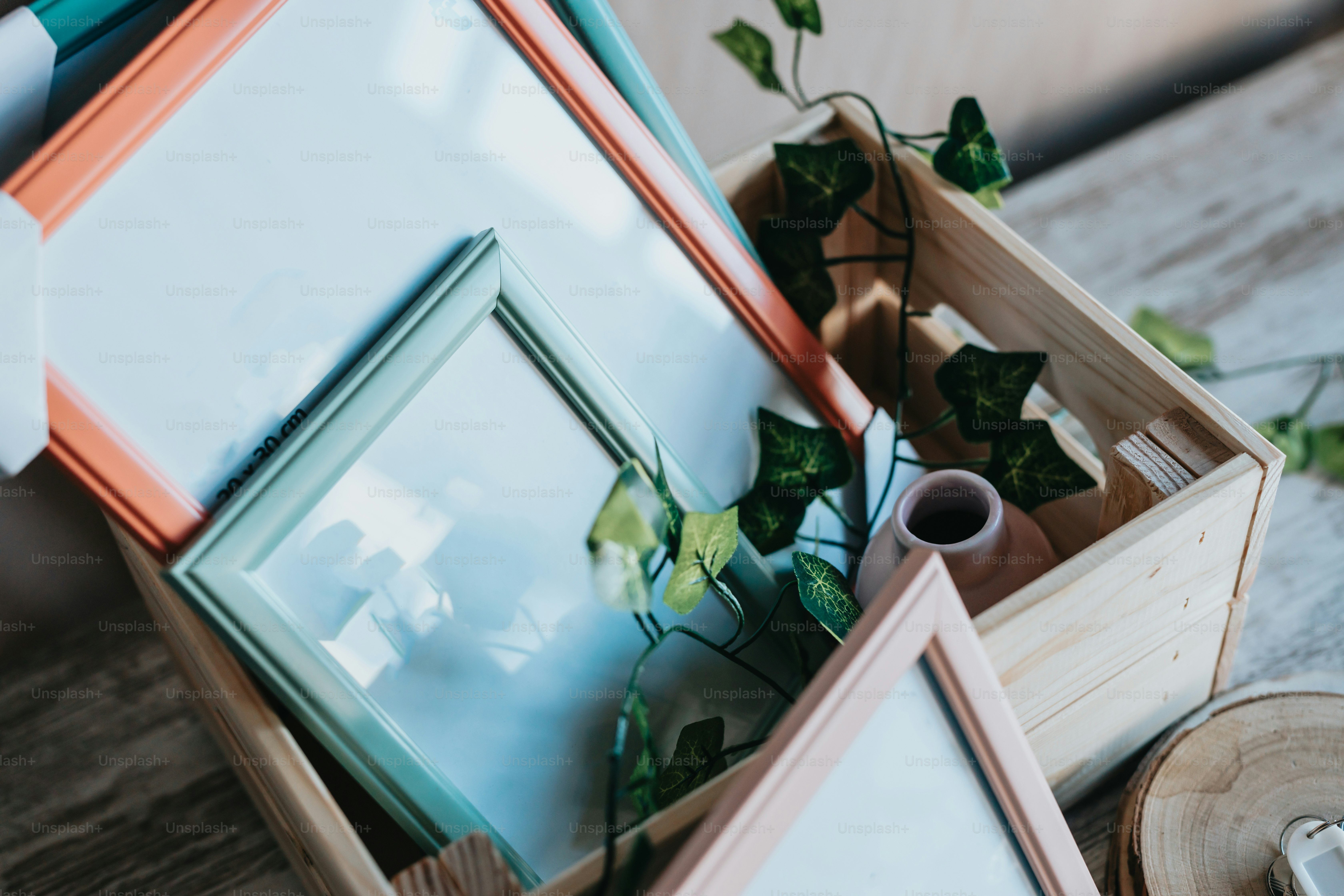 a wooden box filled with assorted framed pictures