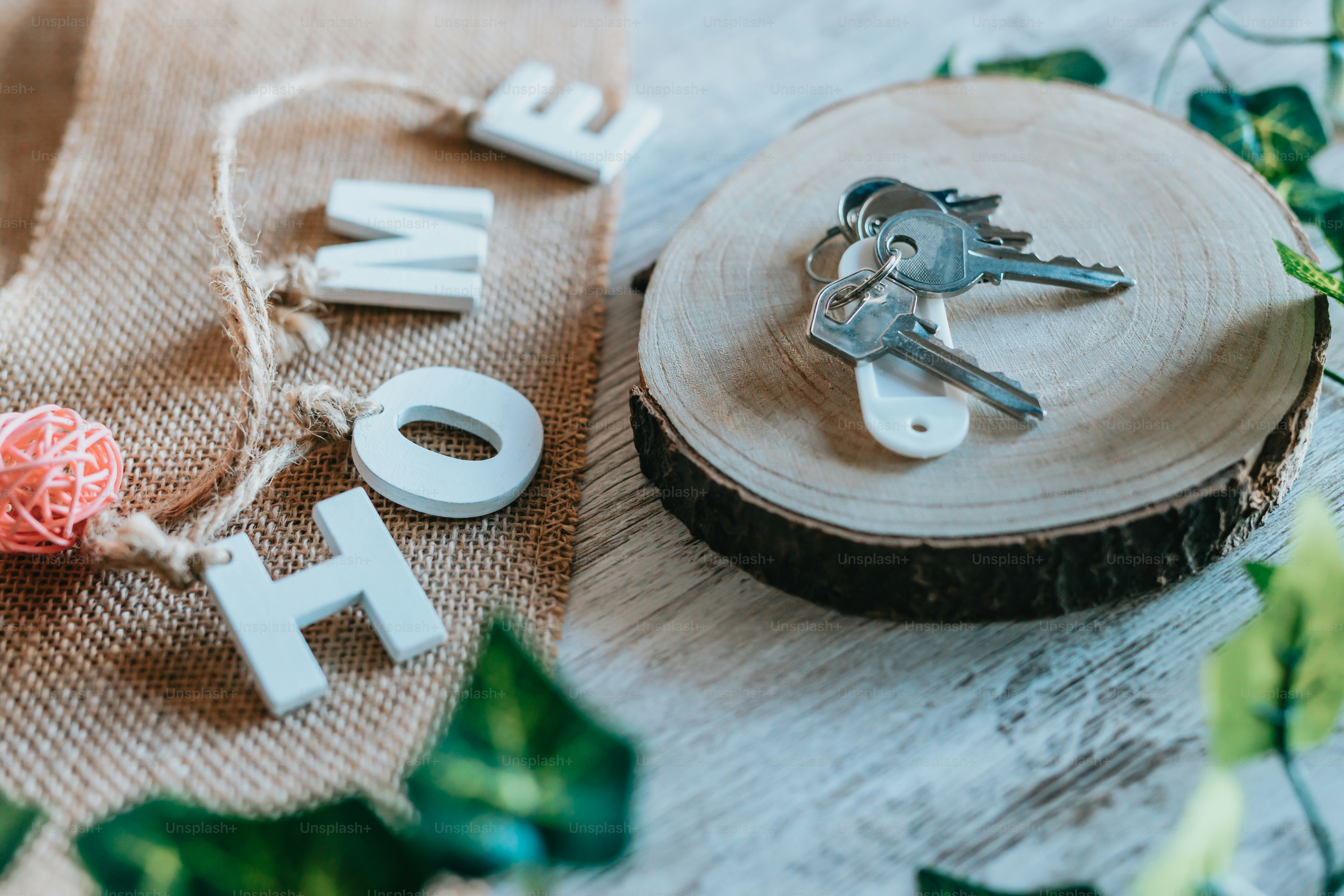 a couple of keys sitting on top of a piece of wood