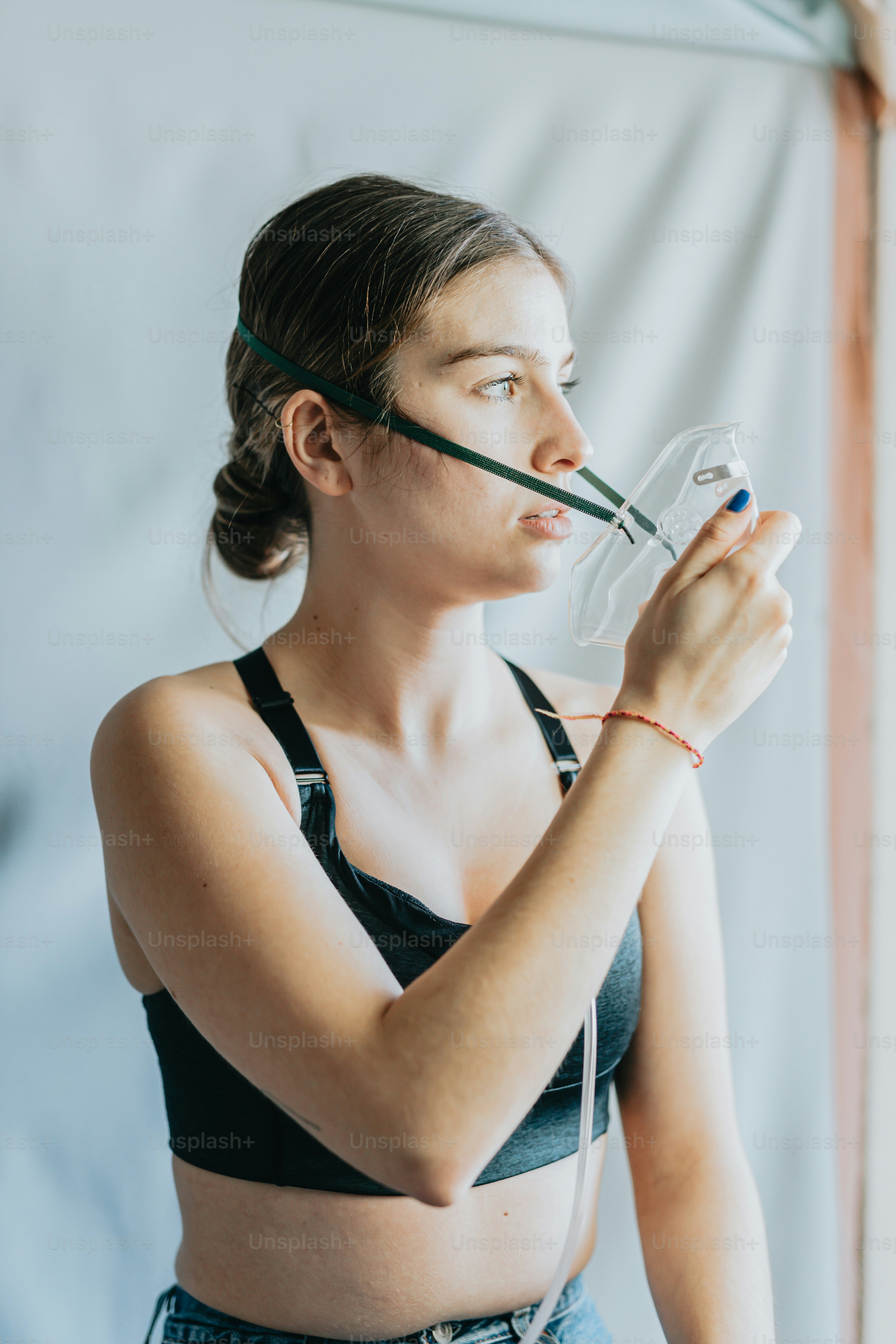a woman wearing a black top and holding a wine glass