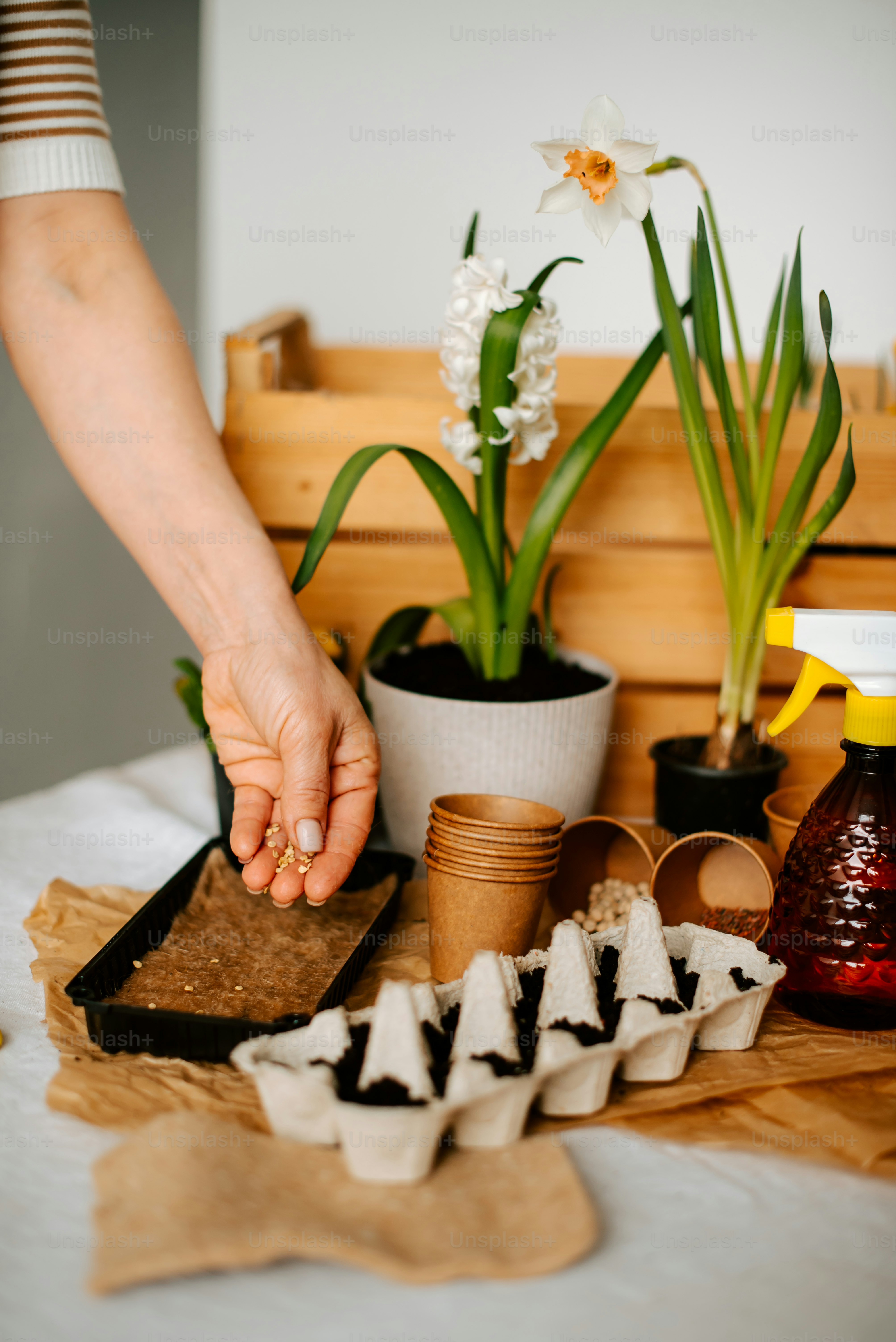 a person holding their hand over a tray of food