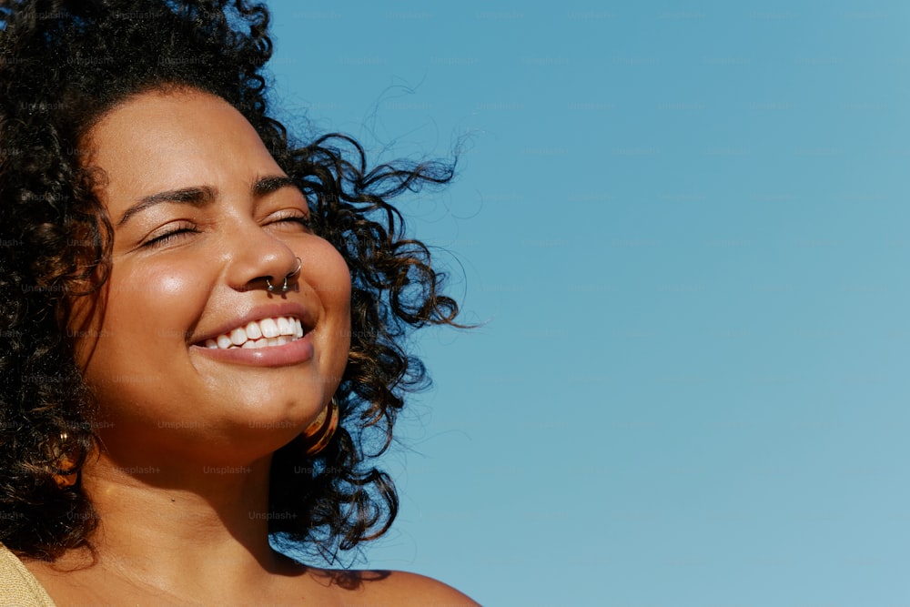 a close up of a person with a smile on her face