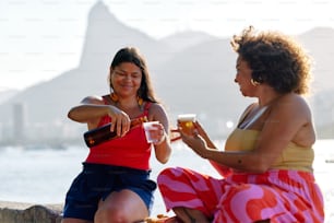 a couple of women sitting next to each other