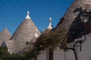 a row of houses with white roof tops