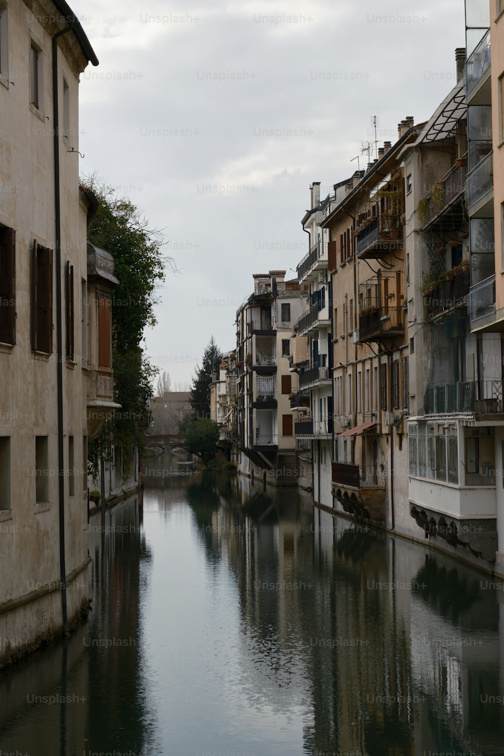 a river running through a city next to tall buildings