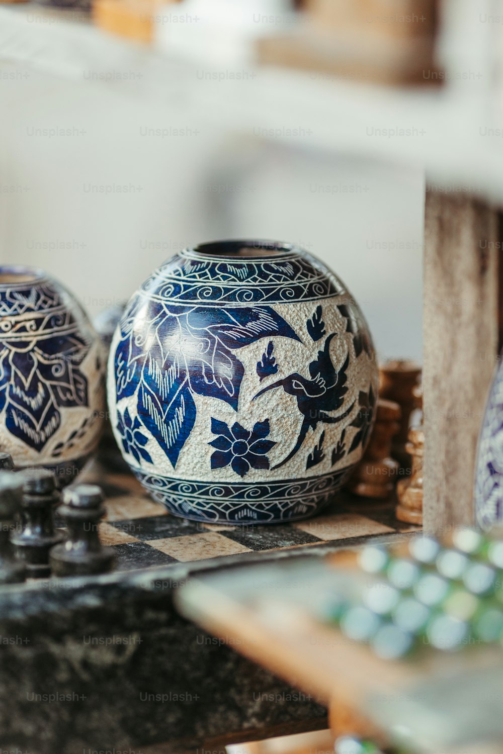 a couple of vases sitting on top of a table