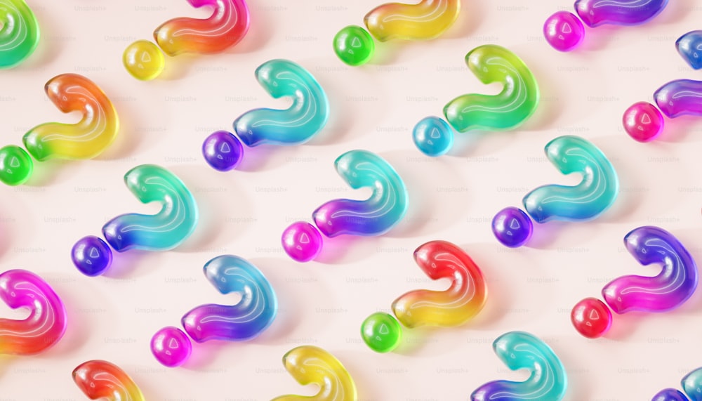 a group of multicolored swirls on a white background