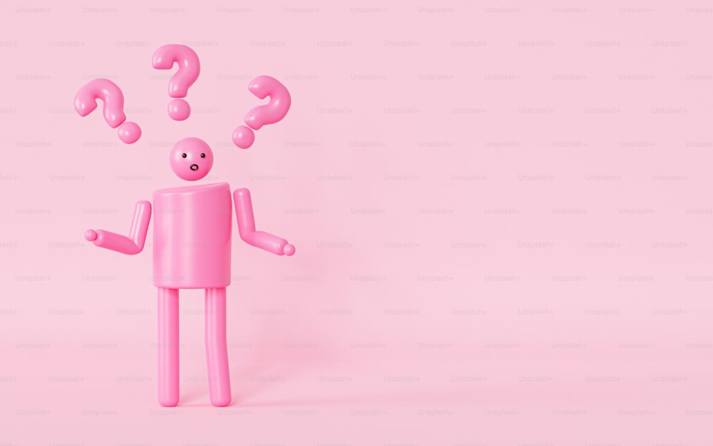 Eine rosafarbene Figur mit Fragezeichen