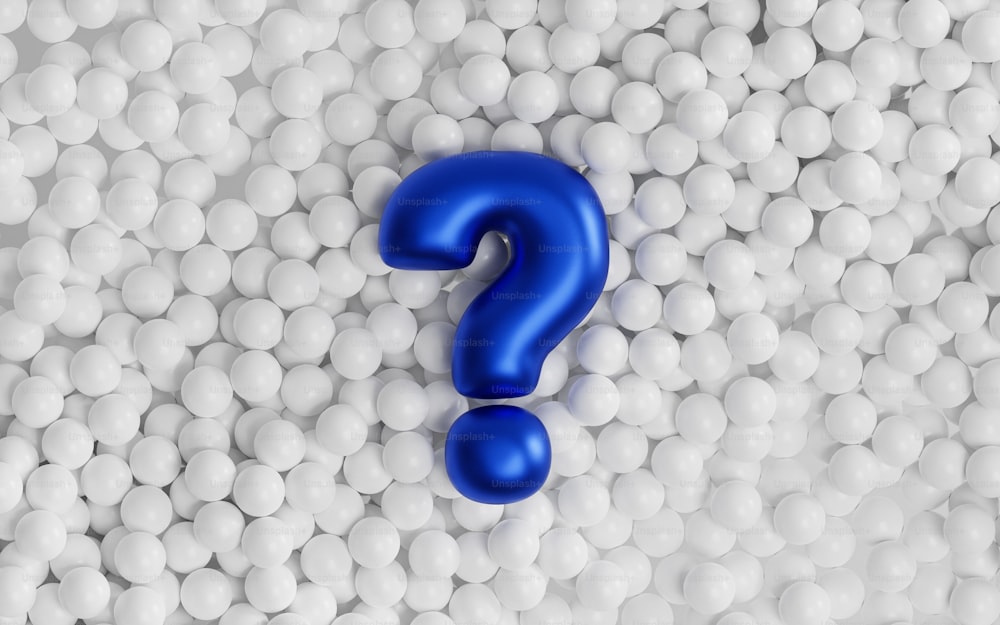 a blue question mark surrounded by white balls