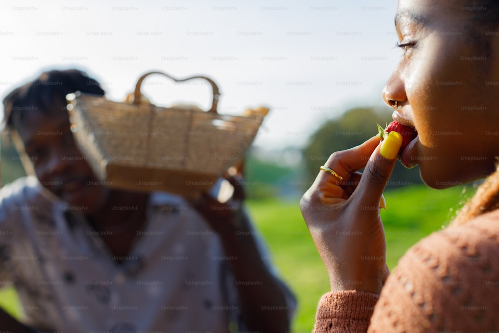 a woman is holding a basket and a man is holding a cell phone