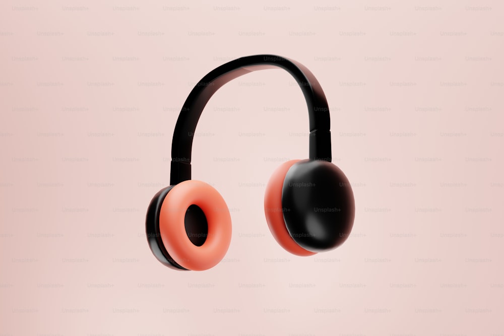 a pair of headphones on a pink background