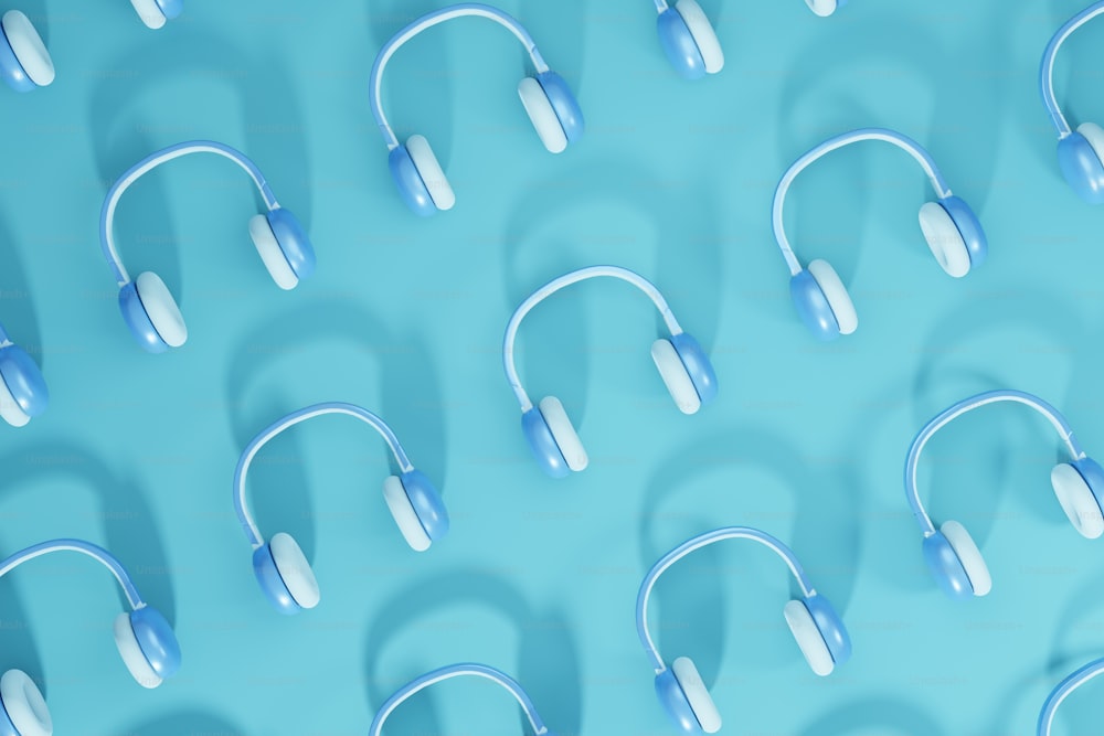 a group of headphones sitting on top of a blue surface