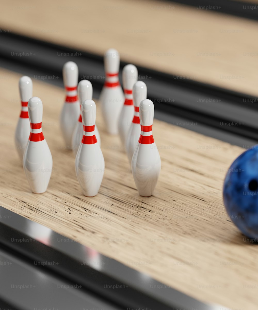 a close up of a bowling ball and pins