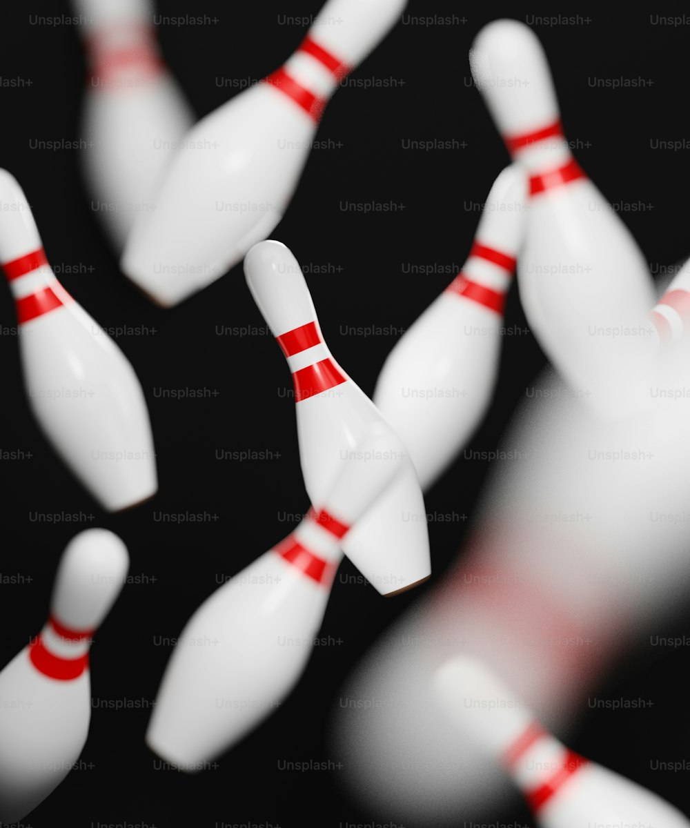 a close up of a bowling ball crashing into the pins
