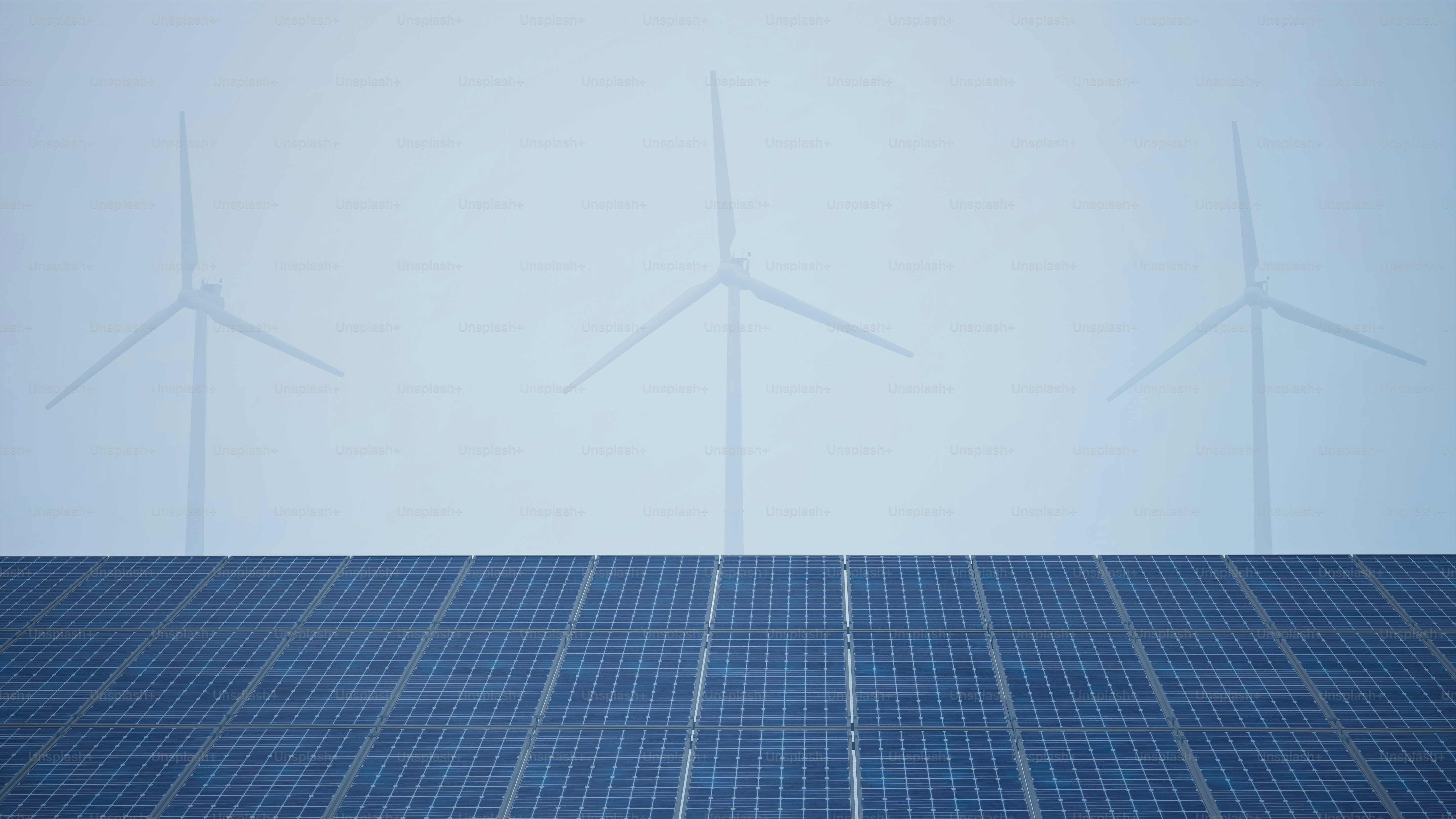 eine Gruppe von Windkraftanlagen auf dem Dach eines Gebäudes