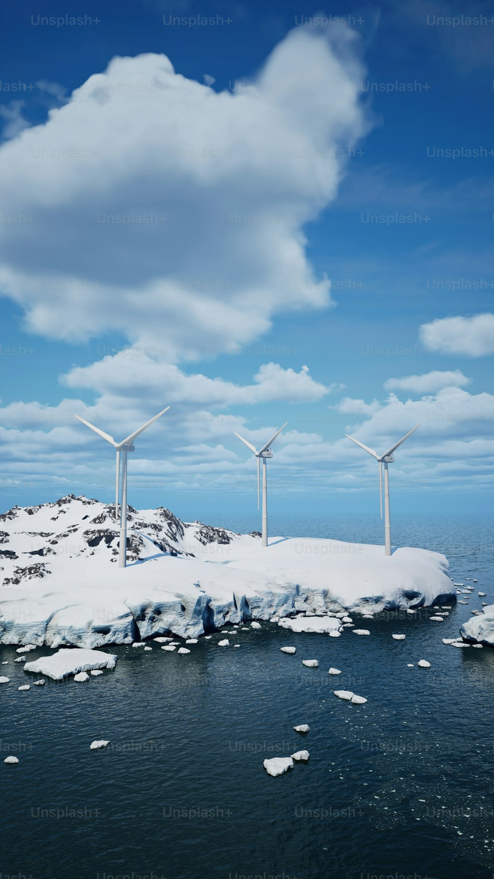a group of wind turbines sitting on top of a snow covered island