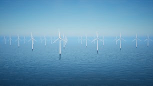 a group of windmills floating on top of a body of water