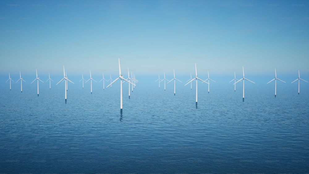 Un grupo de molinos de viento flotando sobre un cuerpo de agua