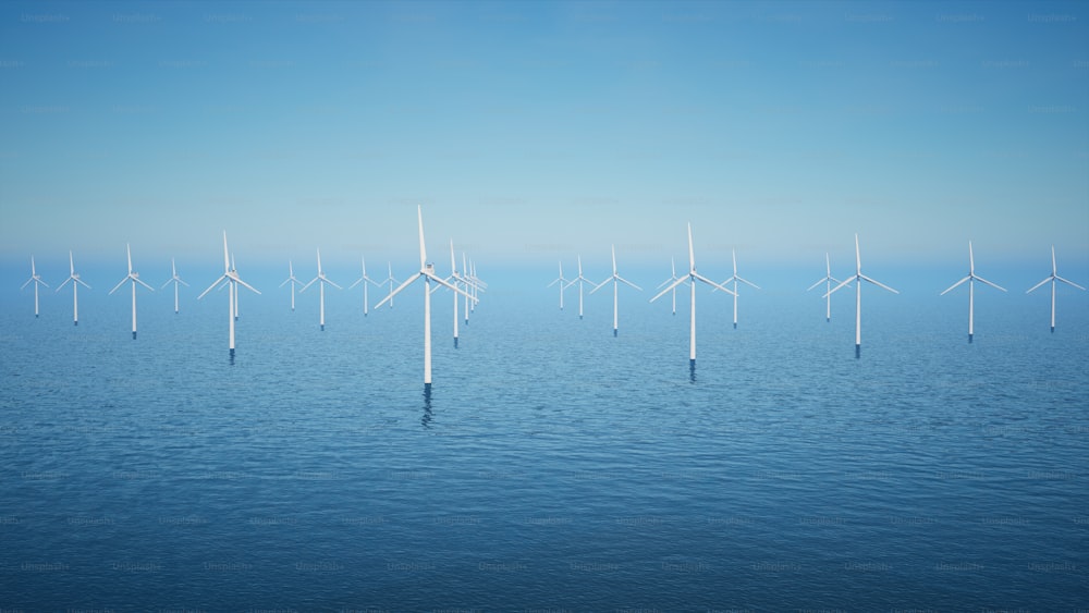 a group of windmills floating on top of a body of water