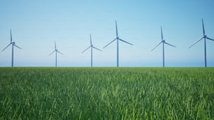 a row of wind turbines in a green field