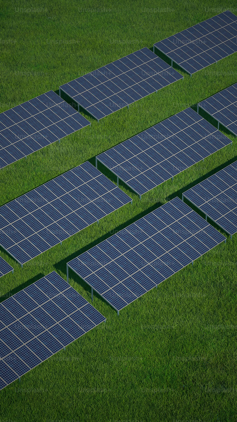 several rows of solar panels in a field