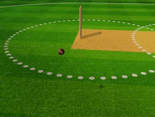 a baseball field with a ball and a bat
