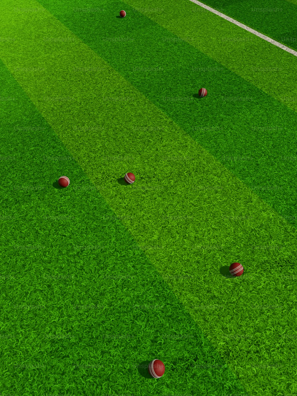 a soccer field with several balls on it