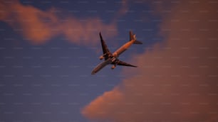 an airplane is flying in the sky at night